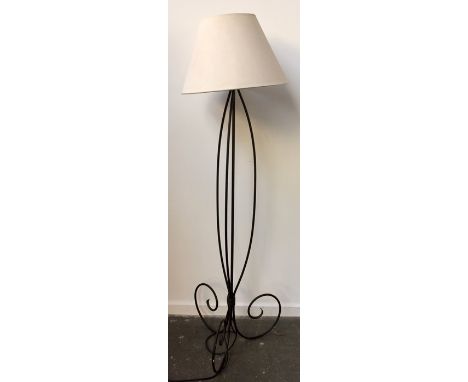 A wrought iron standard lamp
