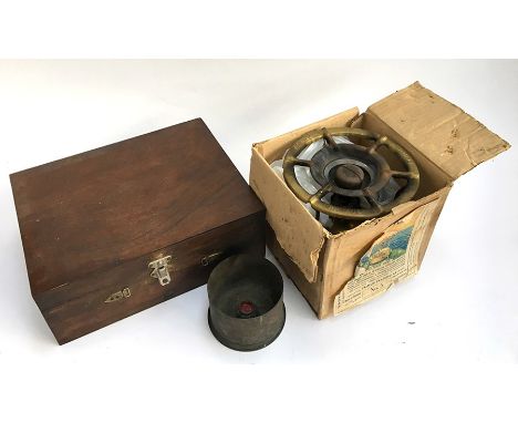 A vintage primus stove, a WW1 brass shell case, and a small teak box