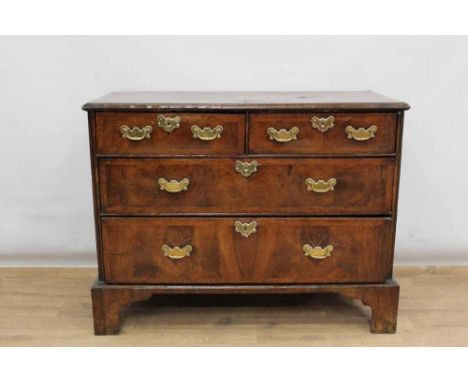 Early 18th century walnut veneered chest of two short and two long drawers with herringbone stringing and crossbanded edge, b