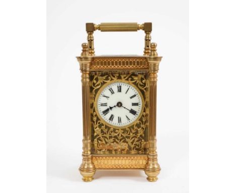 Late 19th / early 20th century French brass carriage clock with gilt metal floral scroll dial and blind fretwork decoration t