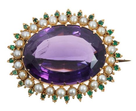 Victorian amethyst seed pearl and emerald brooch with a large oval mixed cut amethyst surrounded by a border of half pearls a