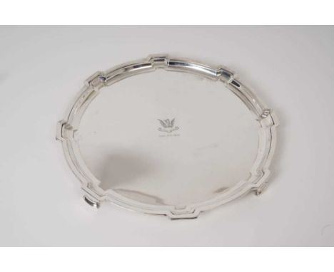 1930s silver salver of shaped circular form, with engraved armorial and presentation date, on four bracket feet (Sheffield 19