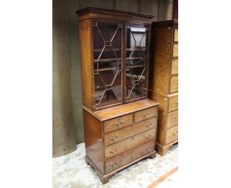 19th century mahogany bookcase on chest, the upper section with adjustable shelves enclosed by pair of astragal glazed doors,