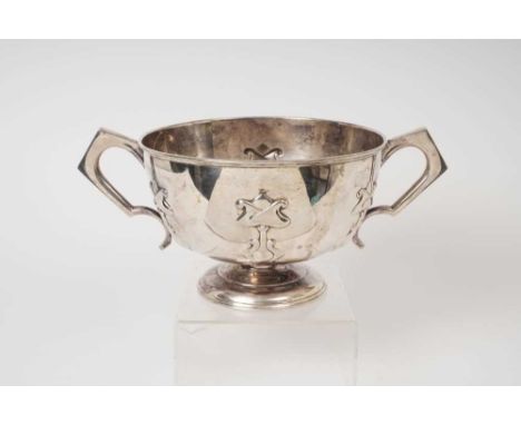 George V silver two handled rose bowl of circular form, with Art Nouveau influenced decoration, on a domed circular base (She