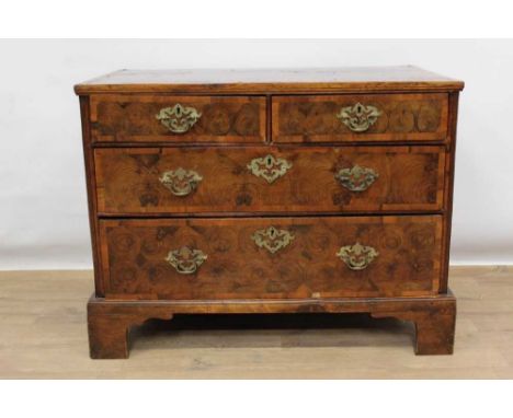 Early 18th century oyster veneered walnut and laburnum chest of two short and two long graduated drawers (alterations), on br