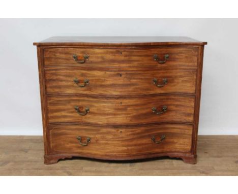 George III mahogany serpentine fronted chest of bold proportions, having four long drawers, each with brass handles, between 