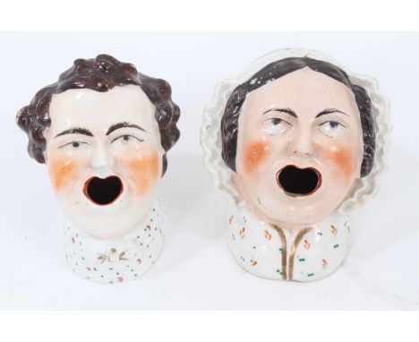 Two Victorian Staffordshire inkwells in the form of male and female headsCondition report: Both with some enamel wear and nib