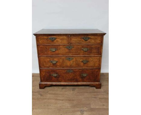 Good 18th century walnut feather banded chest of drawers, with geometric inlaid top and two short over three long drawers on 
