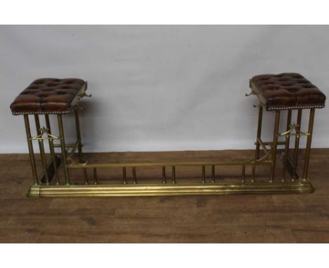 Small size leather and brass club fender, button leather seats raised on balustrade supports to the moulded kerb, 133cm wide 