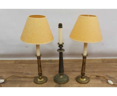 Pair of 19th century style brass lamps, with shades 56cm high, together with a similar lamp. (3)