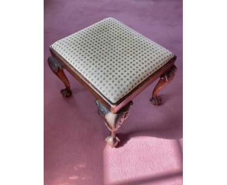 Queen Anne style beech stool, raised on acanthus carved claw and ball feet, 56cm wide