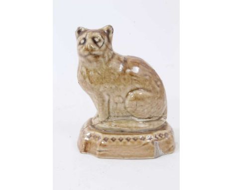 A small lead glazed stoneware model of a cat, circa 1820, shown seated on a cushion base, 7.25cm highCondition report: Chips 