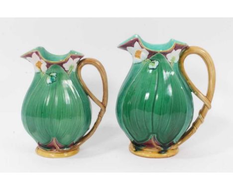 Two Victorian Minton majolica jugs, moulded with large leaves and flowers, model numbers 1228, 20cm and 22.5cm highCondition 