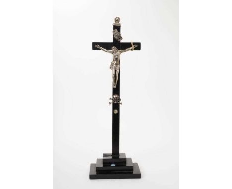 Antique, possibly 18th century, silver crucifix mounted on an Ebony cross with stepped base, with additional silver finial, I