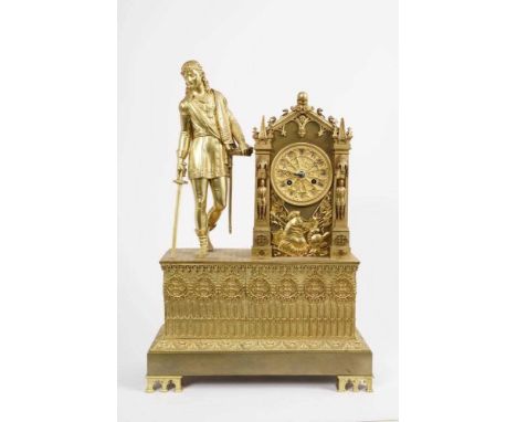 19th century French mantel clock in gothic revival architectural ormolu case with knight surmount and trophy of arms decorati