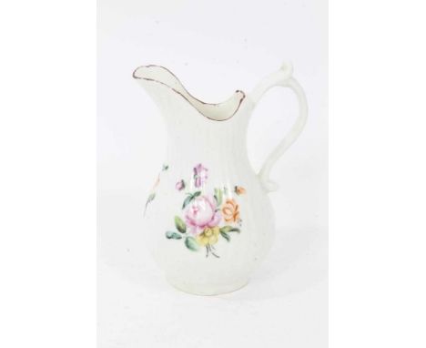 A Derby fluted baluster shaped milk jug, circa 1760, polychrome painted with floral sprays, red-painted rim, 10.5cm highGood 