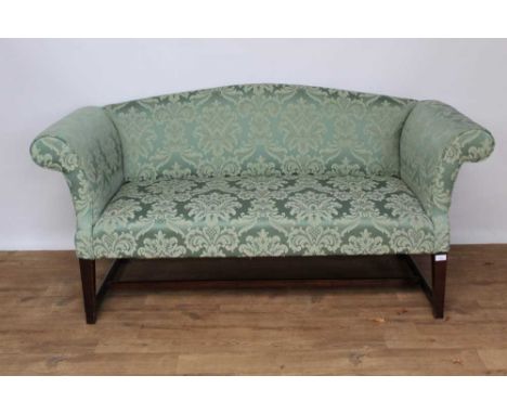 Good quality George III style camel back sofa, with scrolled arms and green foliate upholstery on tapered square supports