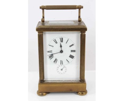 Good quality Edwardian cased carriage clock with alarm movement. The brass case with reeded columns to corners in leather tra
