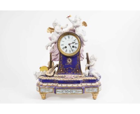 19th century French mantel clock in porcelain case with ornate cherub and musical trophy decoration, dial and movement signed