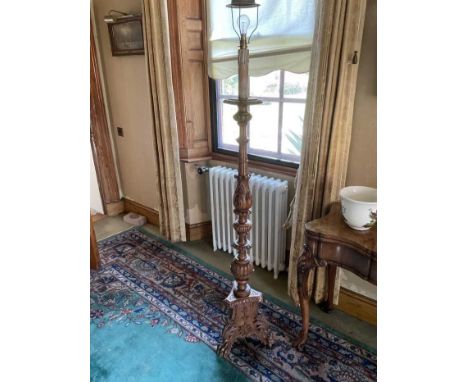 Italian style carved torchère standard lamp, raised on claw and ball feet, total height 171cm