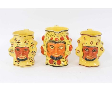 Set of three early 19th century Staffordshire canary yellow Satyr-mask jugs, 11cm and 12cm highCondition report: Some rubbing