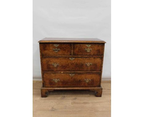 18th century walnut crossbanded chest of drawers, with quarter veneered top and two short over two long drawers on bracket fe