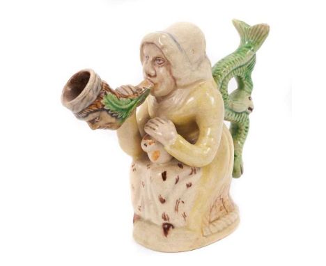 Prattware figure, circa 1810, in the form of Martha Gunn smoking a large pipe, with a serpent form handle and cat on her lap,
