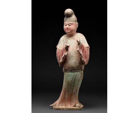 Tang Dynasty, Circa 618 -906 AD A beautifully hollow-moulded musician figurine, featuring distinctive characteristics of an i