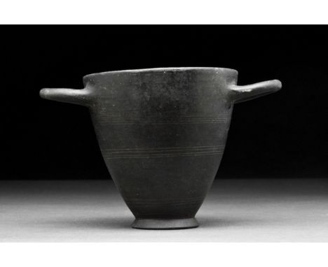 Northern Italy, Etruria, circa 650 – 550 BC. A pottery vessel in the form of wine cup, also referred to as a skyphos, in what