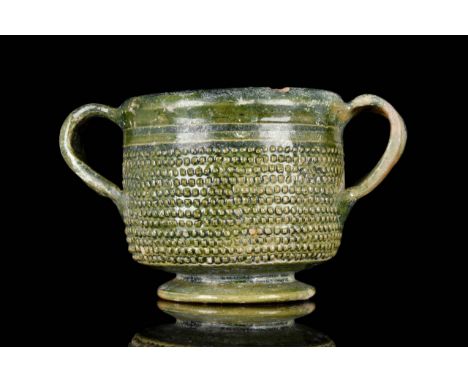 Republican to early Imperial Period, circa 100 BC – 100 AD. A rare lead-glazed pottery skyphos, mottled to a dark green glaze