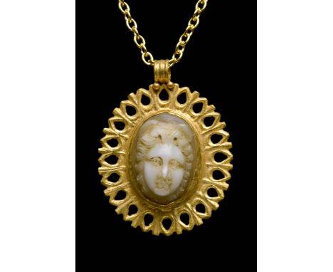 Circa 200-300 AD. A finely carved agate cameo depicting the head of Medusa in a beautiful gold setting - oval in form with en