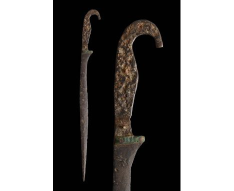Circa 400 BC. An exquisite Greek iron falcata "kopis" sword, with a heavy single-edged blade widening towards the point. The 