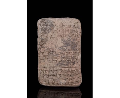 Circa 1900 BC. A large rectangular Babylonian clay cuneiform tablet with columns of cuneiform text. Clay cuneiform tablets we