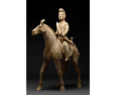 Tang Dynasty, circa 618 -906 AD A breath-takingly beautiful, modelled horse depicted mid-stride, with head raised, mouth clos