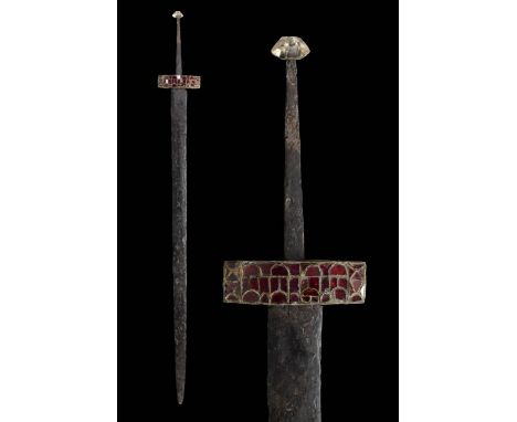 Circa 600 AD. A spatha longsword comprising a lentoid-section iron parallel-sided blade with broad tapering tip; formed by th