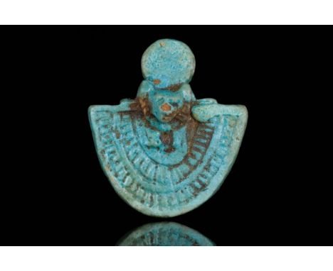 Late Period, circa 664-32 BC A light faience composition amulet in high relief, with head of Sekhmet with sun-disk over her h