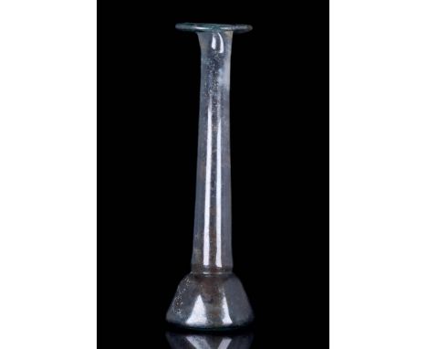 Circa 200-300 AD A well blown candlestick unguentarium in aqua coloured glass. The vessel, still showing some of its original