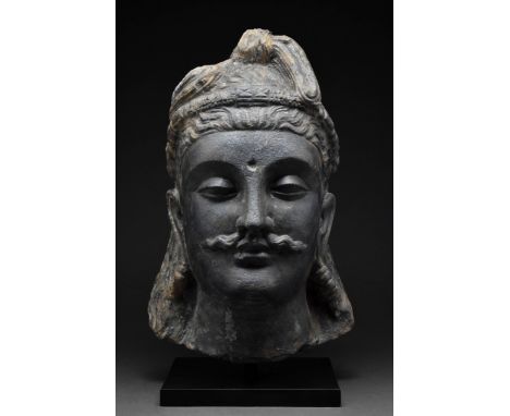 Circa 200-300 AD A remarkable example of Kushan artistry, richly carved in grey schist, combining naturalism of the classical