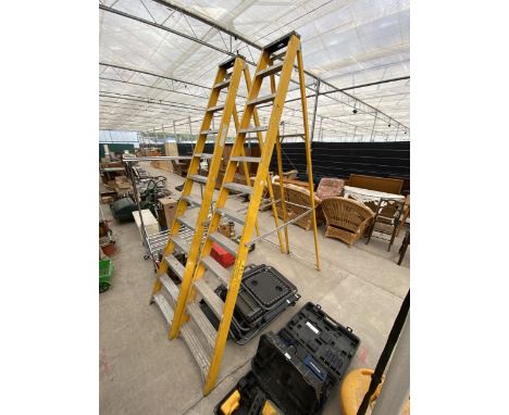 AN ELEVEN RUNG METAL STEP LADDER 