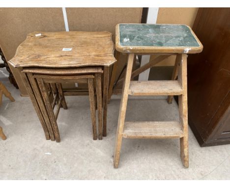 AN OAK NEST OF THREE TABLES AND FOLDING STEP STOOL 