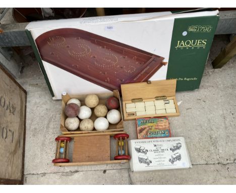 AN ASSORTMENT OF VINTAGE AND RETRO GAMES TO INCLUDE A JAQUES BAGATELLE, CRICKET BALLS AND DOMINOES ETC 