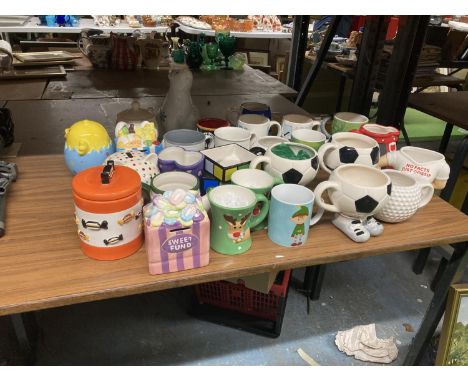 A LARGE QUANTITY OF CERAMIC COLLECTABLE MUGS AND MONEY BOXES 