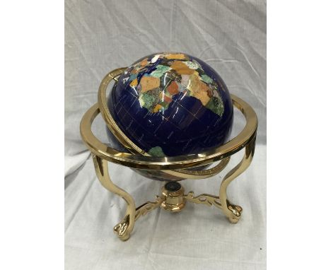 A GLOBE WITH MOTHER OF PEARL INLAYS ON BRASS ROTATING STAND H: 45CM 