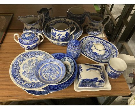 A QUANTITY OF BLUE &amp; WHITE CERAMIC WARE TO IJNCLUDE JUGS, PLATES, LARGE SERVING BOWL, COVERED BUTTER DISH SOME BY WADE, M