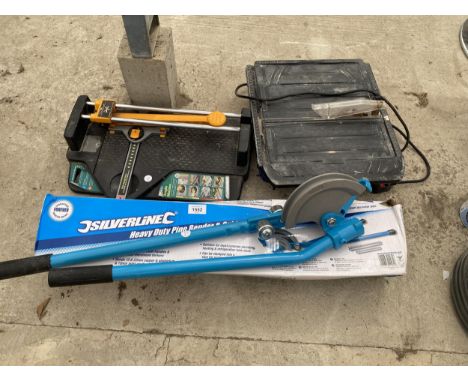 AN ASSORTMENT OF TOOLS TO INCLUDE AN ELECTRIC TILE CUTTER AND A PIPE BENDER ETC 