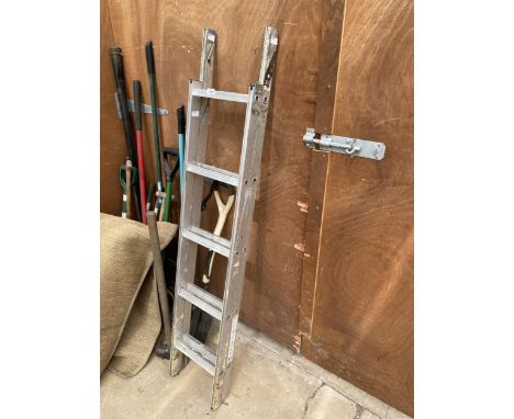 AN ASSORTMENT OF TOOLS TO INCLUDE A LADDER, FORKS AND SPADES ETC 