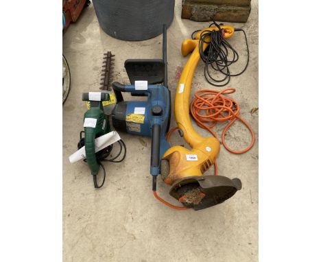 AN ELECTRIC HEDGE TRIMMER, AN ELECTRIC CHAINSAW AND A GARDEN STRIMMER 