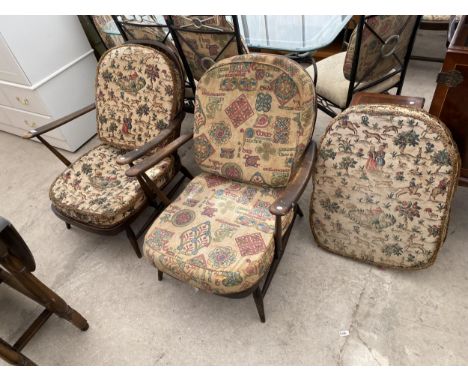 A PAIR OF ERCOL SPINDLE BACK LOW FIRESIDE CHAIRS 