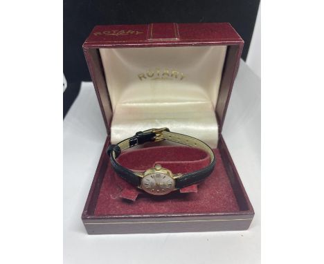 A 9 CART GOLD ROTARY WRIST WATCH IN A PRESENTATION BOX 
