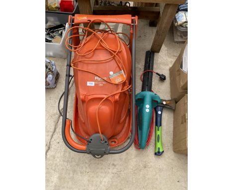 AN ELECTRIC FLYMO HOVER VAC, A BOSCH ELECTRIC HEDGE TRIMMER AND AN AXE 